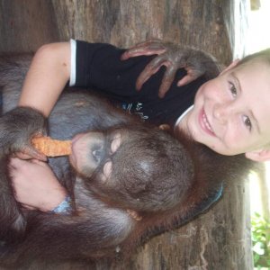 jordy holding a orangutan