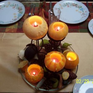 ignore the date, stupid friggen camera.  I made the center piece.  I bought the candles, gourds, candle holders and froufrou stuff myself, came up wit