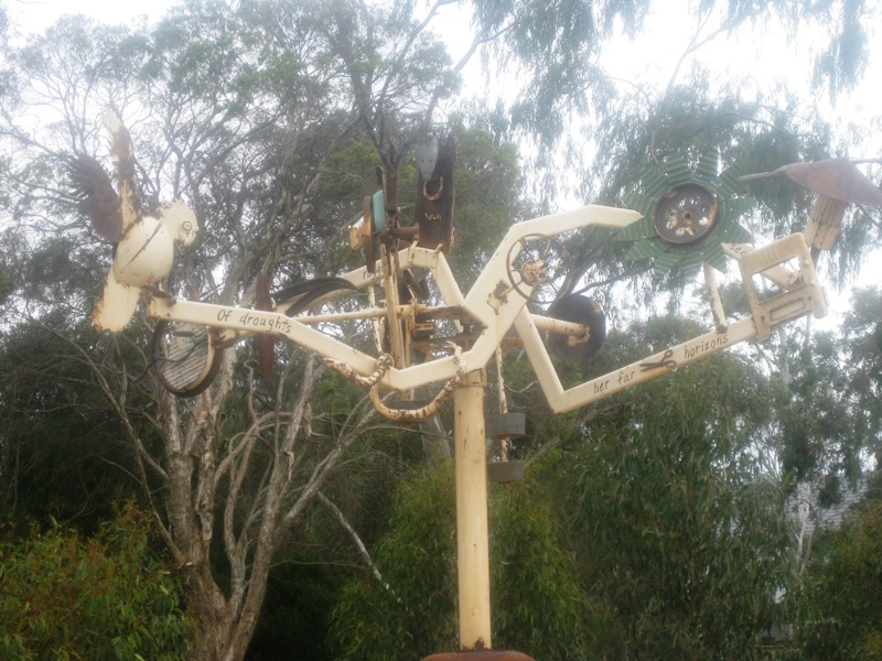 A bizzare weathervane.  "I Love a Sunburnt Country" verses are inscribed on the vane arms.