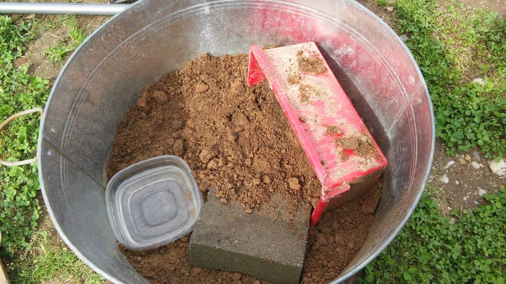 First temporary set up outside using the dirt he was found in. A plank of wood was used to cover the top of it so he wouldn't be expressed to too much