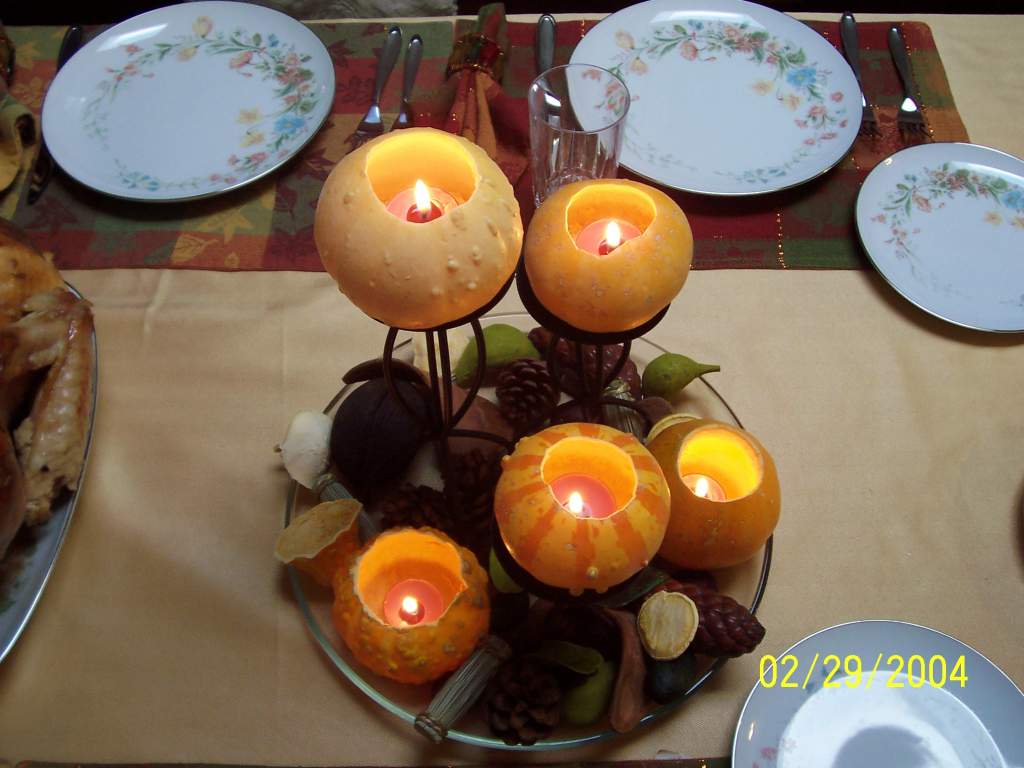 ignore the date, stupid friggen camera.  I made the center piece.  I bought the candles, gourds, candle holders and froufrou stuff myself, came up wit