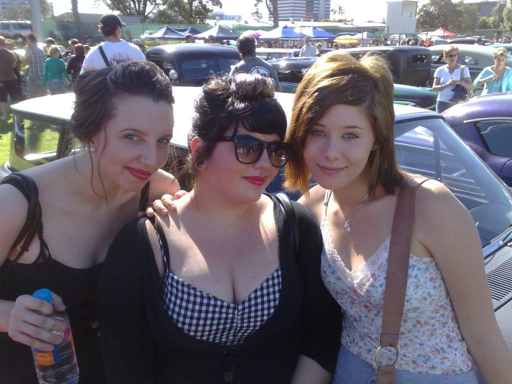 My friend's sister, my friend and me, at a car show.