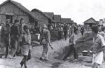 My Grandfather is the tall guy with curly hair in left side of pic.  He is pow here at Camp ODonnell and was later transferred to the notorious death 