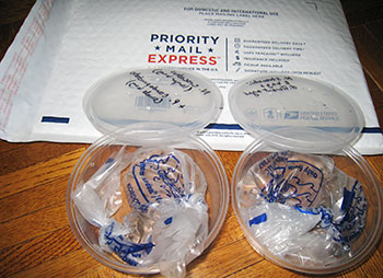 Shipping newt eggs using small breather bags. The bags contain a small amount of water, no air. Breather bags allow air to transpire. The deli cups ha